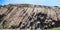 Panorama view of Huge hexagonal columnar joints of volcanic rock at Hong Kong Global Geopark geological park, China