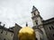 Panorama view of Kapitelplatz with golden ball monument statue sculpture Sphaera and cathedral Salzburg Austria alps