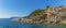 A panorama view from the landing stage across the breakwater towards the Cinque Terre village of Riomaggiore, Italy
