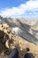 Panorama view with legs, alpine boots, mountain Grossvenediger and glaciers, Hohe Tauern Alps, Austria