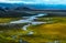 Panorama view of a little creek flow though the beautiful grass land