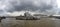 Panorama view of the London Eye over looking ominous storm clouds, London, Westminster