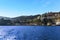 A panorama view looking towards the shore past the harbour wall of the marina Piccola, Sorrento, Italy from a boat heading to