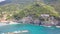 Panorama view of Monterosso al Mare village one of Cinque Terre in La Spezia, Italy. drone flies along the coast and overlooks