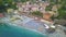 Panorama view of Monterosso al Mare village one of Cinque Terre in La Spezia, Italy. Flight along the beach, umbrellas, people