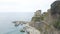 Panorama view of Monterosso al Mare village one of Cinque Terre in La Spezia, Italy. The view opens onto the peninsula, beach, sea