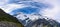 Panorama view the mueller glacier at kea point in Mount Cook National Park, the rocky mountains and green grasses