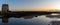 Panorama view of old windmill ruins and tidal pools on the coast of Murcia at sunset