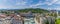 A panorama view over rooftops towards Tivoli Park from central Ljubljana