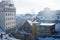 Panorama view over Zagreb with smoking chimneys during winter with snow over the roofs, Zagreb, Croatia, Europe