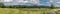 A panorama view of Pendle Hill and gathering rain clouds.