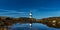 Panorama view of the Penmon Lighthouse in North Wales with relfections in a tidal pool