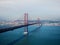 Panorama view of red suspension bridge Ponte 25 de abril over Tagus Tejo river Almada Lisbon Portugal Europe