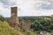 Panorama view of ruins of castle Loewenburg on a hill spur and Eifel village Monreal, Germany
