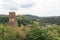 Panorama view of ruins of castle Loewenburg on a hill spur and Eifel village Monreal, Germany