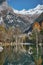 Panorama view of small lake with reflections and multicolor woods, in autumn season lake in Val di Mello, Val Masino , Italy -