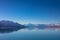 Panorama view of snow, mountain layer, ice and lake with reflect