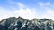 Panorama View of a striking mountain dusted with snow on a sunny day