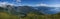 A panorama view from the summit of Raudmelen peak overlooking the town of Balestrand, Norway and Sognefjorden during a summer