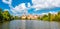 Panorama view of Telc city, Czech Republic. Historical castle above the lake. UNESCO heritage. Summer day, blue sky with clouds