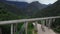 Panorama view of two lane bridge driveway in the mountains