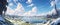 Panorama view of vast grassland with lake against blue cloudy sky. AI Generated