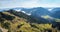 Panorama view from Wendelstein mountain, green pasture in the bavarian alps and valley