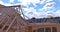 Panorama viewed of closeup new stick built home under construction under framing structure wood frame beams with