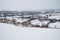 Panorama of a village in Europe, covered with snow after a snowfall.