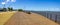 Panorama with walkpath, buildings and lake at Guaiba shore