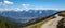 Panorama from the Wank in Bavaria with a view of the Wetterstein Mountains and the Karvendel Mountains. A hiking trail on the Wank