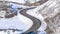 Panorama Wasatch Mountain landscape with road and houses on snowy residential community