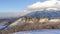 Panorama Wasatch Mountains landscape in winter with houses sitting on the snowy slope