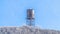 Panorama Water tank towering over frosted trees on snowy Wasatch Mountain in winter