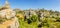 A panorama of weathered limestone rock stacks and a cliff face in the Karst landscape of El Torcal near to Antequera, Spain