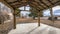 Panorama Whispy white clouds Covered patio in a large backyard with trees and fallen dry leaves