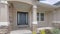 Panorama Whispy white clouds Facade of a front exterior of a house with front yard garden