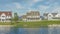 Panorama Whispy white clouds Oquirrh Lake waterfront at Daybreak, Utah residential area