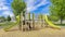 Panorama Whispy white clouds Playground set in a residential community at Utah valley