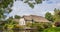 Panorama of a white farm house with thatched roof in Giethoorn
