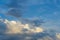 Panorama of white and grey clouds in a blue sunlit bright sky in summer