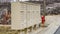 Panorama White metal cluster mailboxes and red fire hydrant along a concrete road