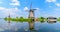 Panorama of the windmills and the reflection on water in Kinderdijk in Rotterdam, Netherlands