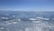 Panorama of the winter lake Baikal. People are skating. Beautiful winter landscape