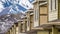 Panorama Winter view of townhouses with a mountain covered with snow in the background