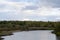 Panorama of the Yakut tundra a little kempendyay river among spruce trees and bushes