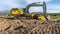 Panorama Yellow construction vehicles at a construction site against mountain and sky