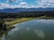 Panorama of Zovnesko jezero or Zovnek lake in Slovenia, on a hot summer day. Visible man made dam in the background used for