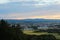 Panoramatic view on city Ceske Budejovice in sunset with trees