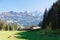 Panoramatic view of Eiger, Jungfraujoch and Jungfrau Region with incoming train from Gruetschalp